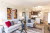Model apartment staged with furniture - living room and kitchen